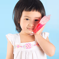child holding ice pack on cheek