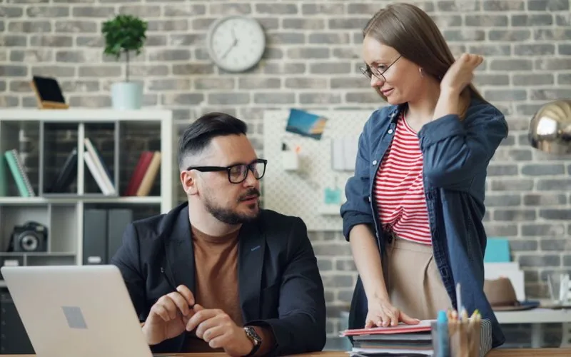A small group talking through a question at a table