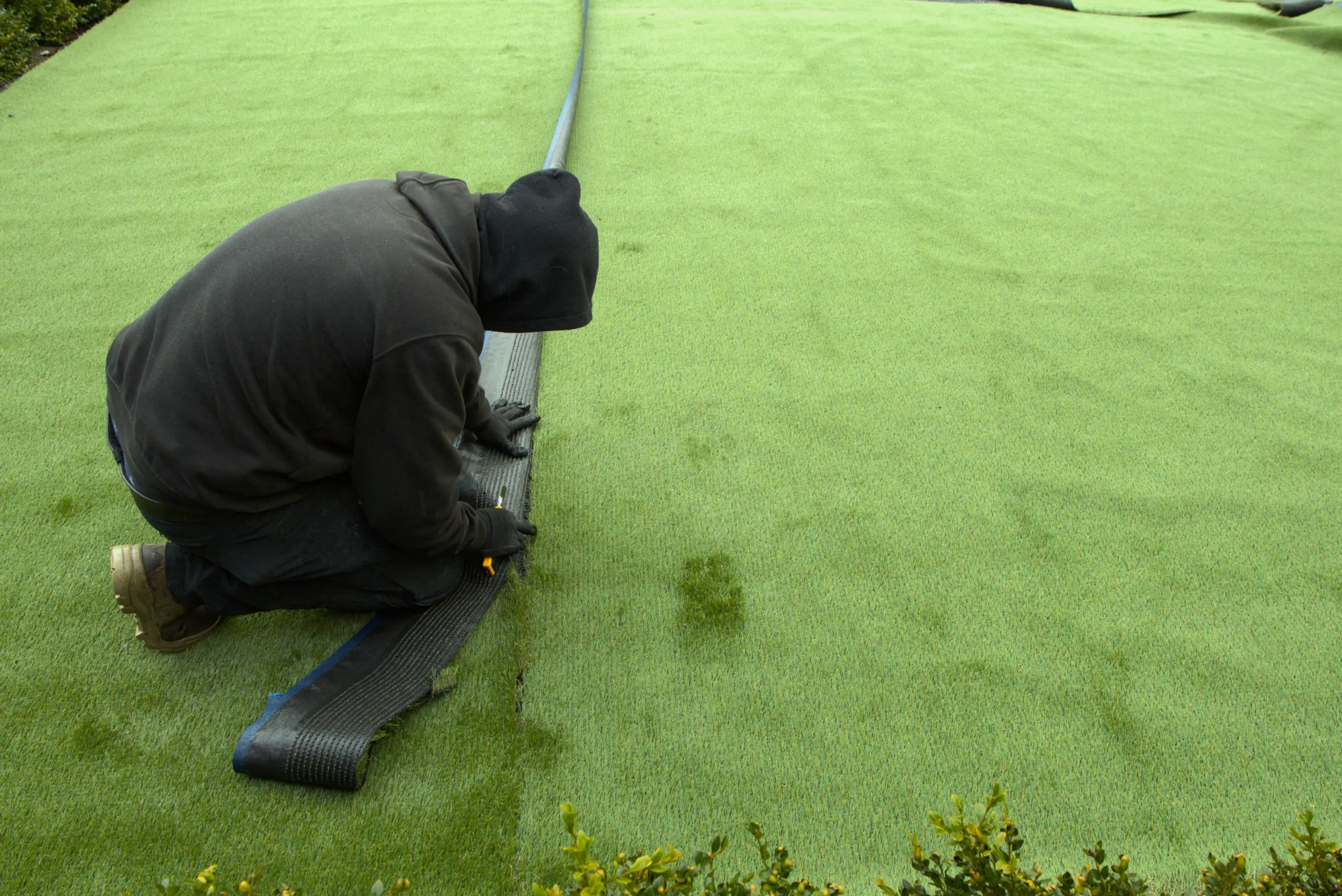 experts at Image Landscaping installing artificial turf
