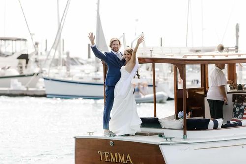 Couple on classic yacht Temma during sunset wedding cruise in Newport, RI