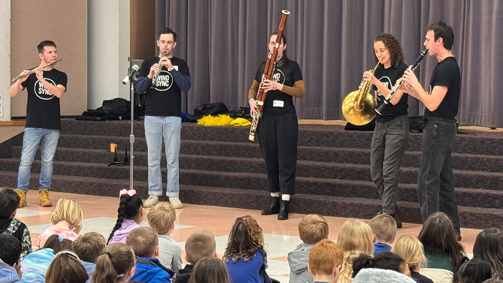 Emerald City Music musicians connecting with community members.