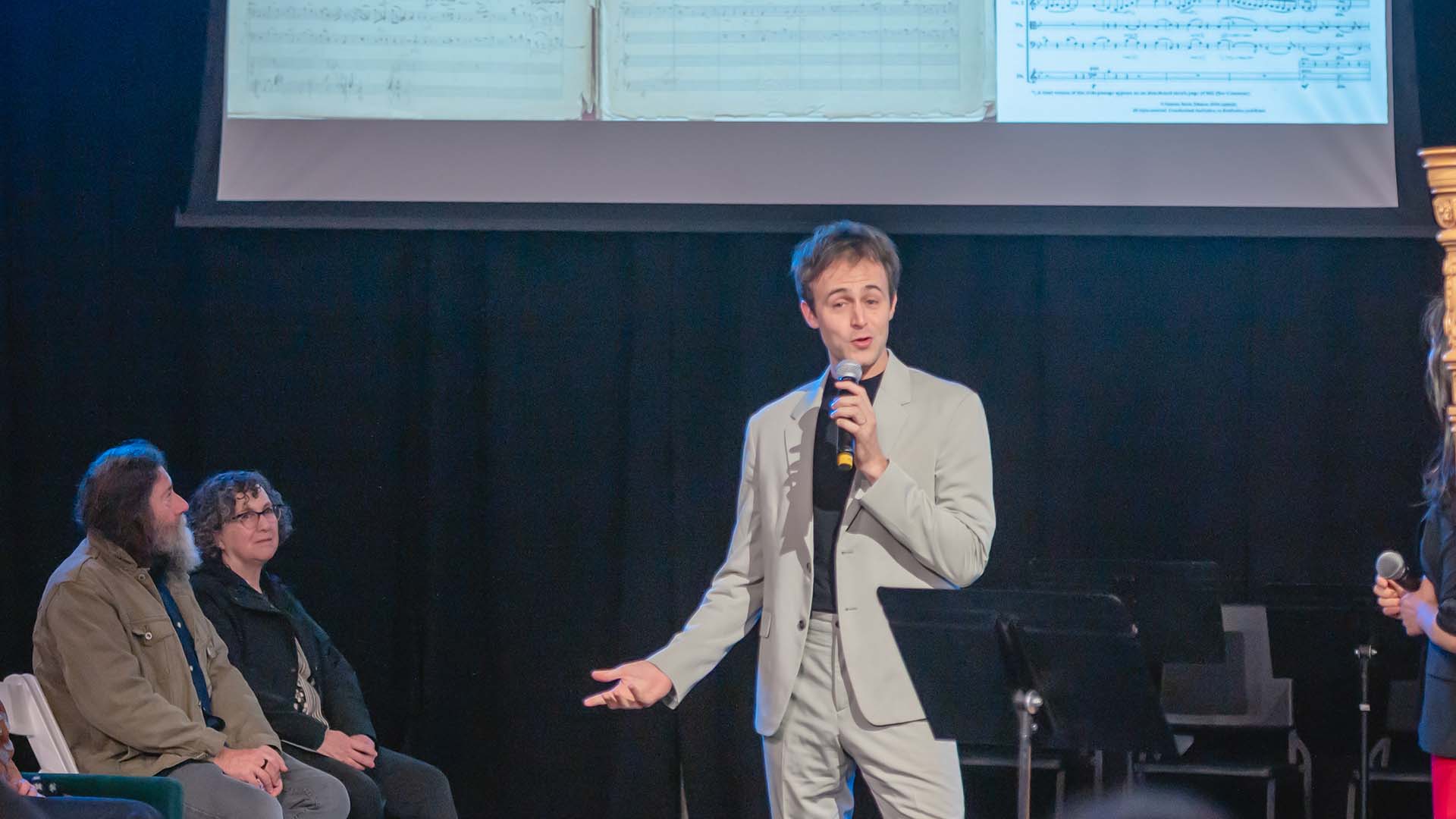 An Emerald City Music musician speaks with the audience during a pre-concert chat.