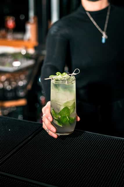 Bartender holding a cocktail