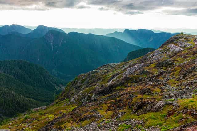 Sun rays shining through mountain peaks