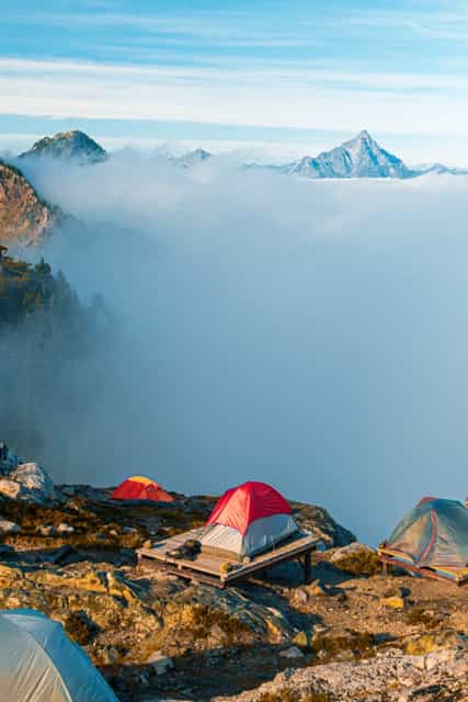 Tent camping above clouds on top of a mountain