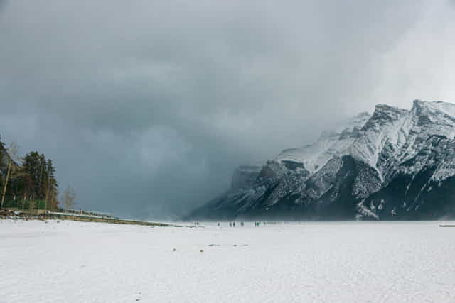 Incoming storm onto a frozen Lake Minnewanka