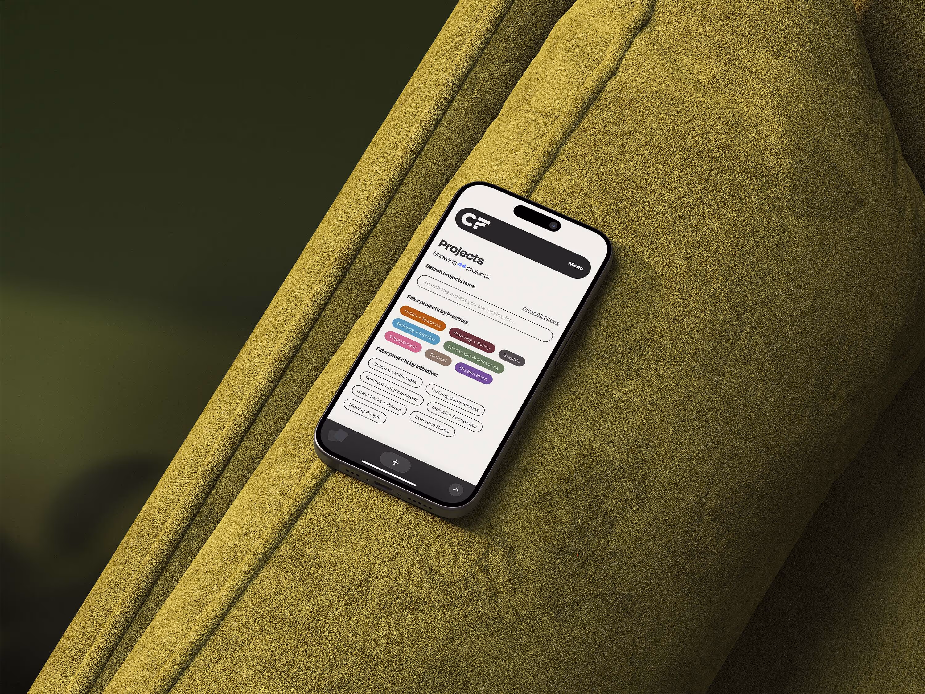 mockup of Mobile website on a green couch