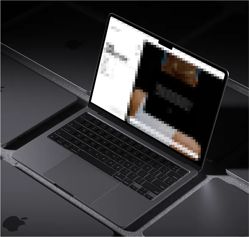 A row of laptops with a pixelated screen