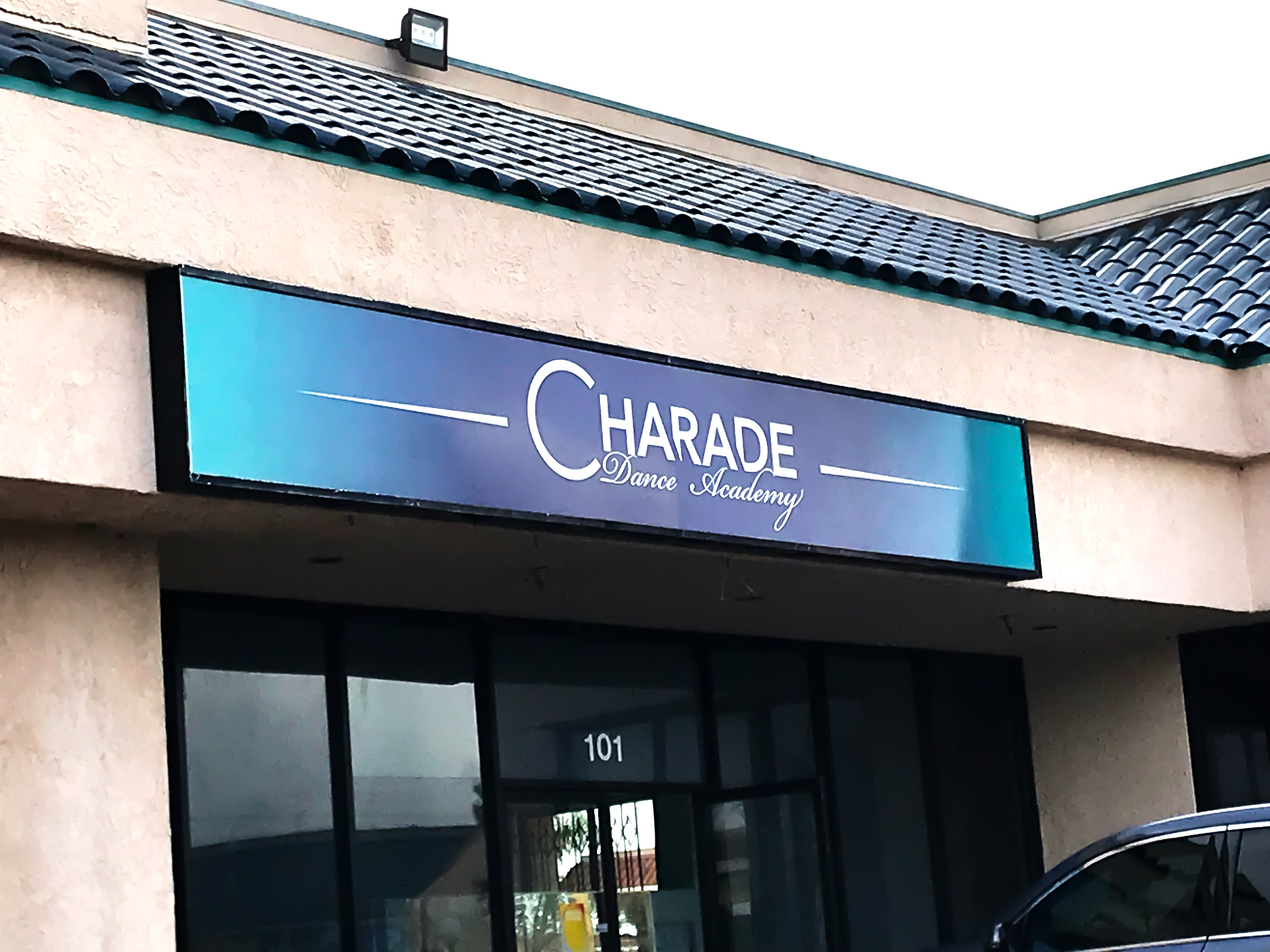 Dance studio signage above business.