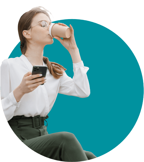 Woman in glasses drinking coffee and holding phone
