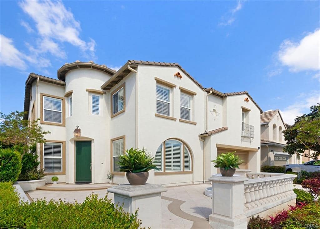 Exterior of home with white stucco