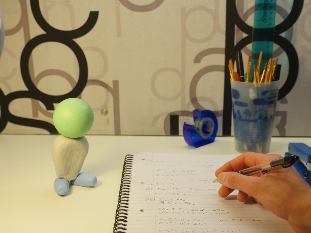 Personified clay model on work desk