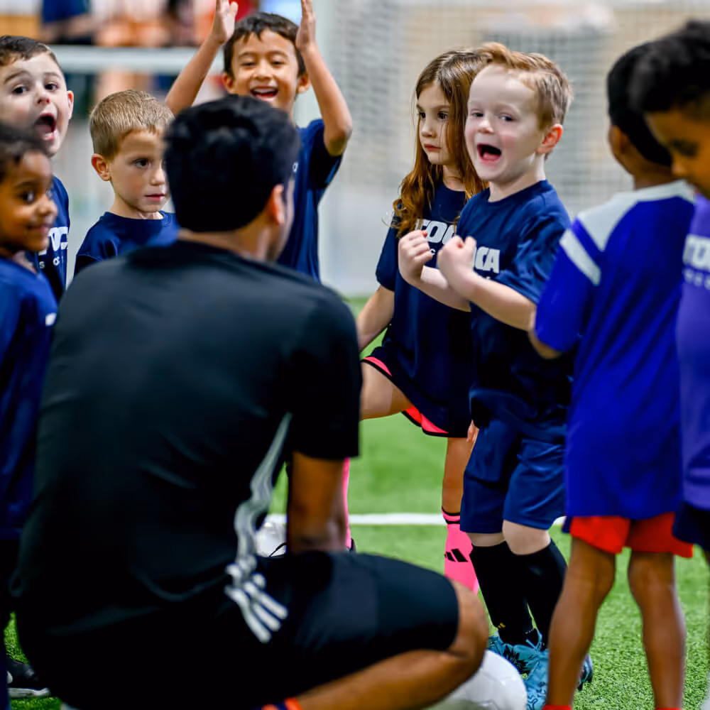 Youth soccer players in a huddle
