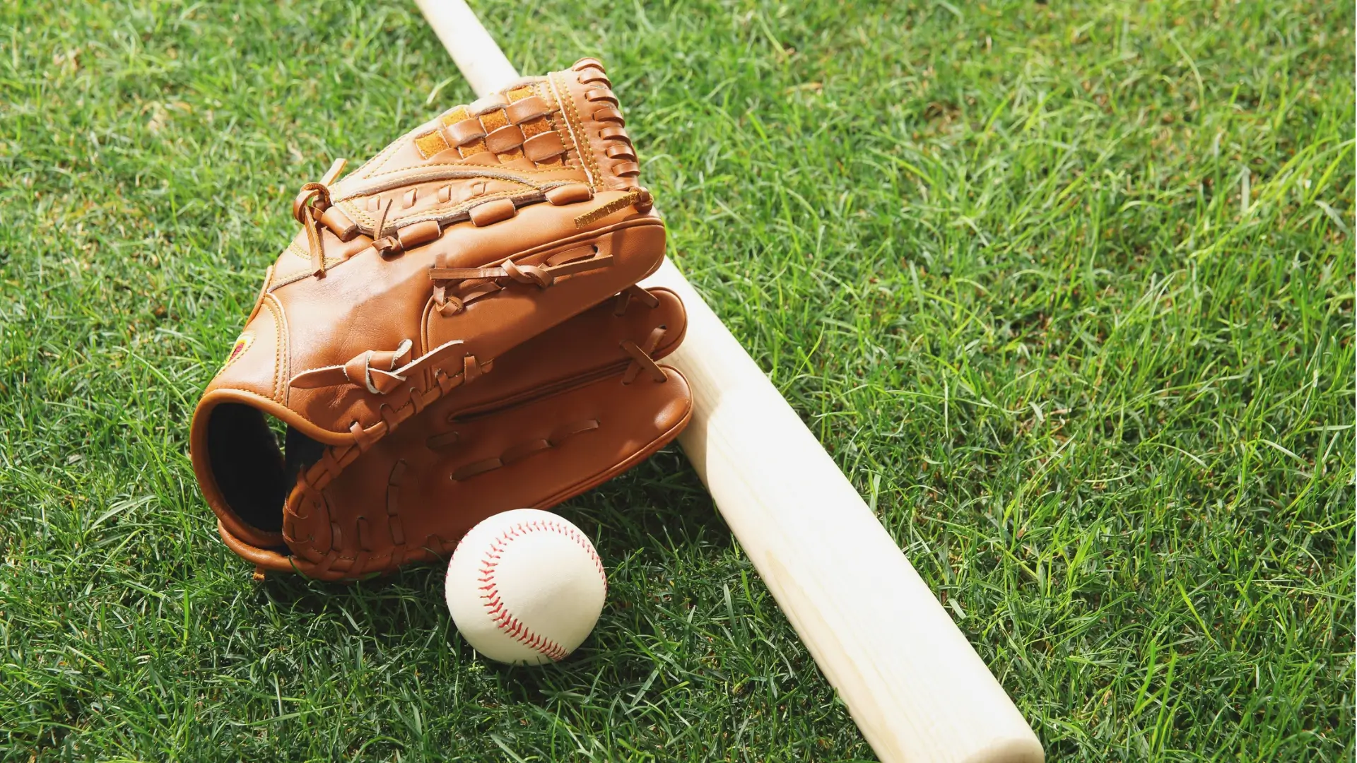 Young baseball players sharpening their swings together in a TOCA indoor training facility, having fun while practicing and building skills.
