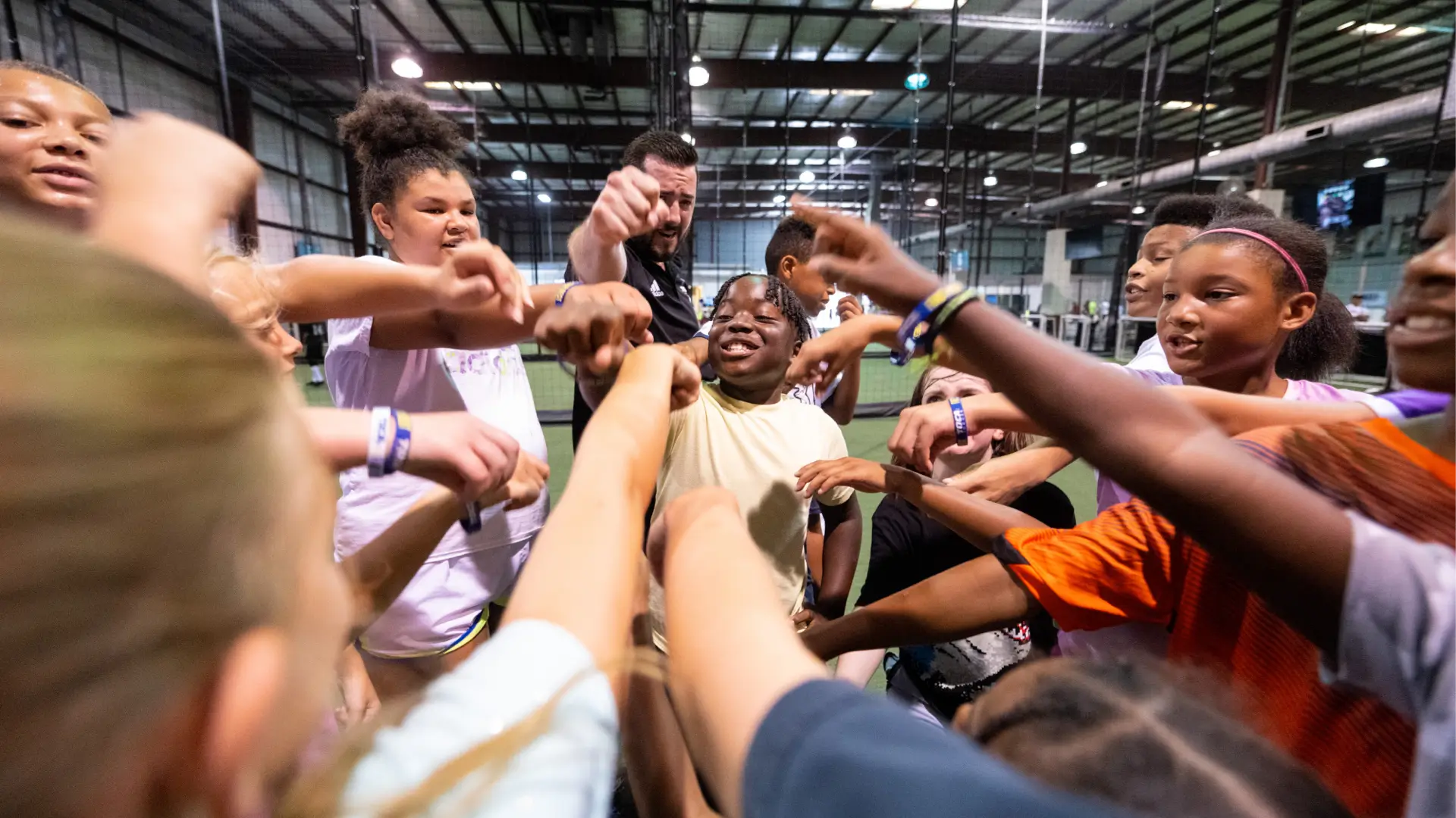 TOCA Multisport kids class on an indoor soccer field.