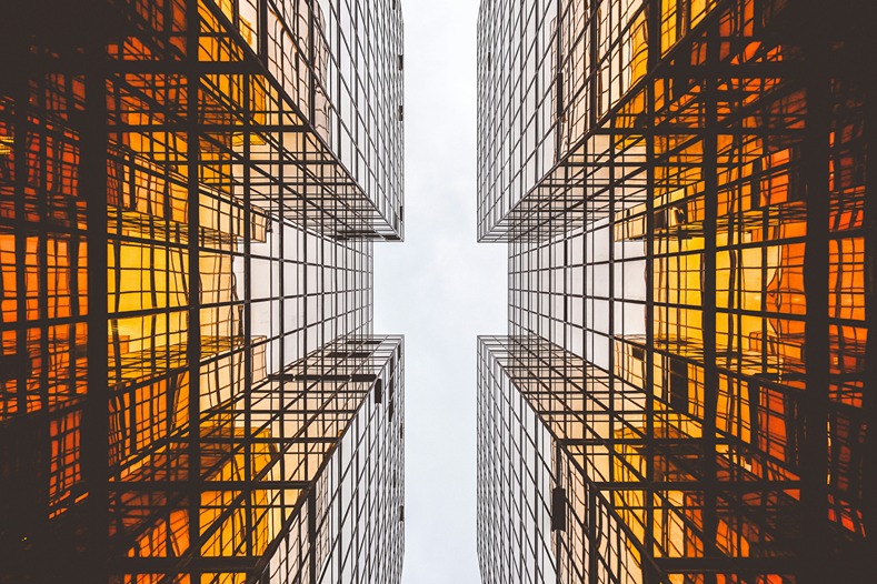 between two skyscrapers bathed in golden light