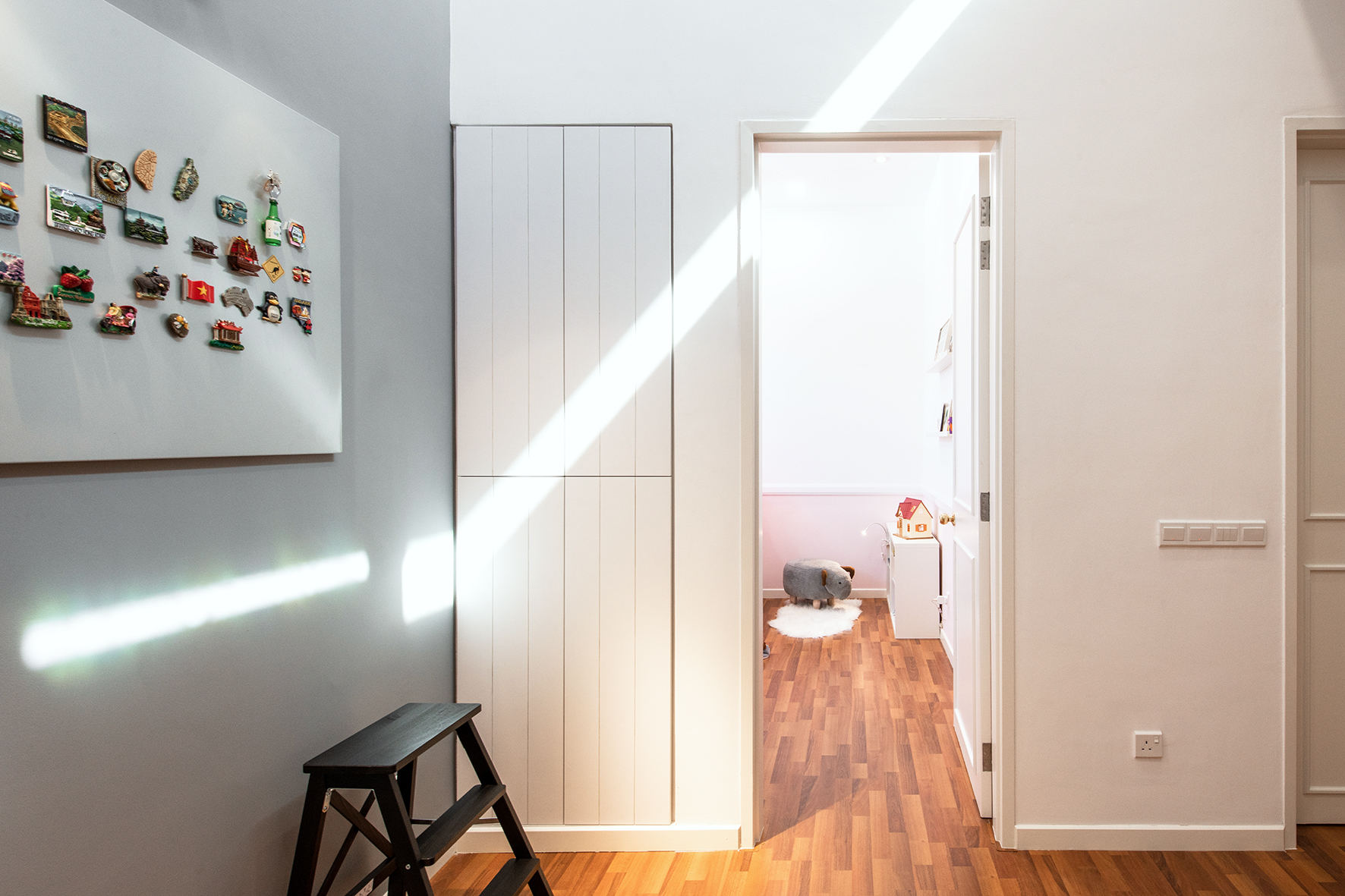 Entry into Kids room with a concealed storage cabinet.