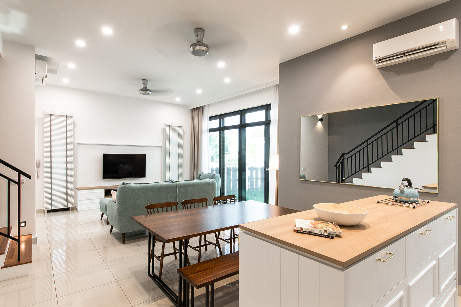 White kitchen island with wooden textured top