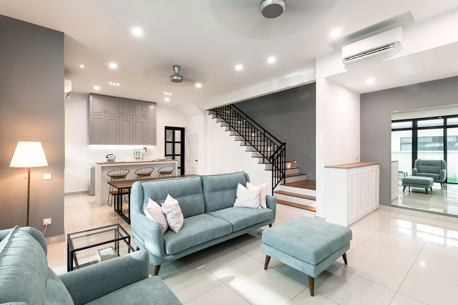 Living area with baby blue-green sofa sets