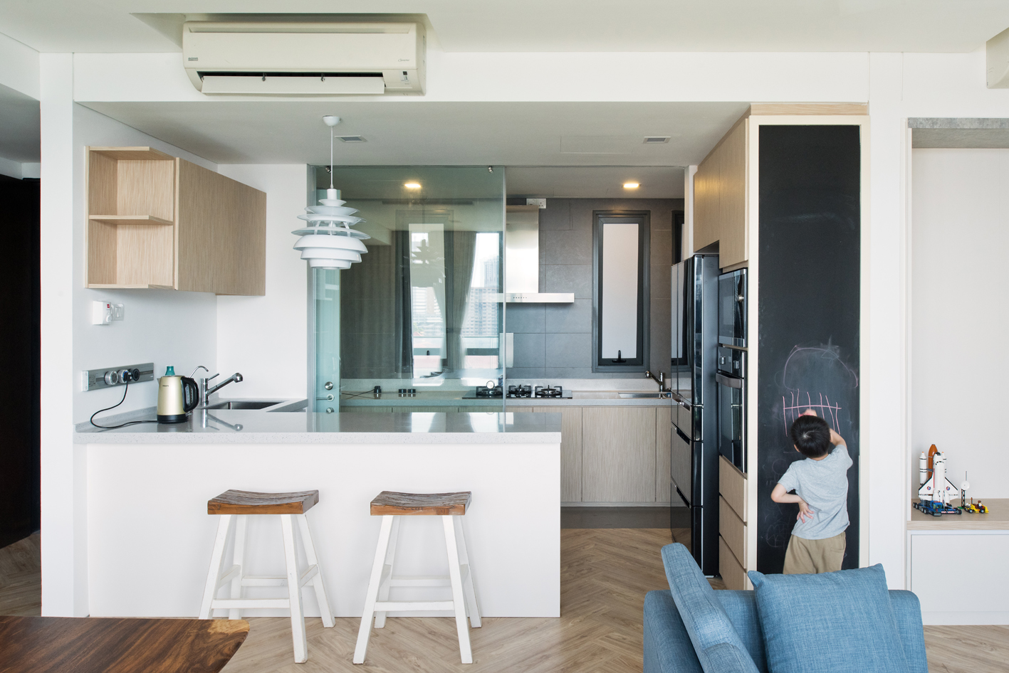Open kitchen with a sleek chalkboard for the kids.