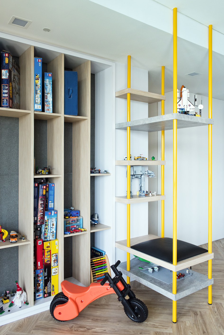 Playful open display for the toys. A bench replicating a swing.