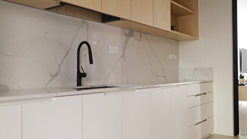 A white kitchen base with a sink