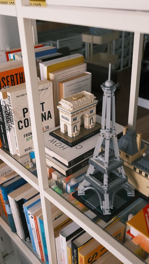 Collection of books and Lego on display