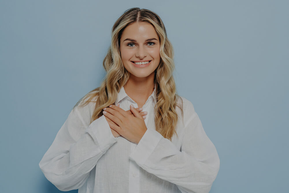 woman posing on a light blue background