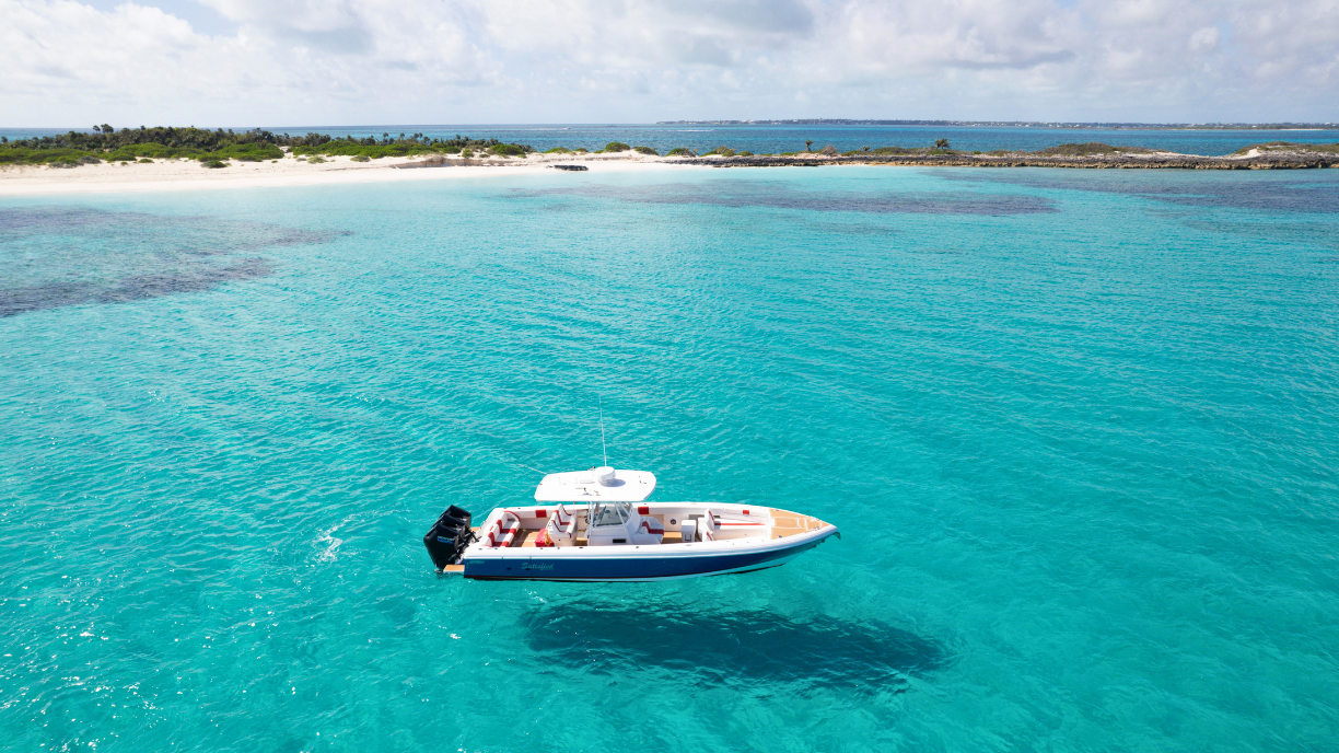 boat seating area with blue and orange patterned pillows