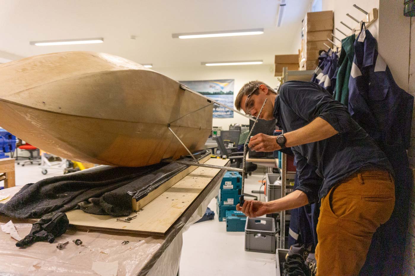 Picture of a Flying Fish team member building the Flying Fish 1 hydrofoil demonstrator boat