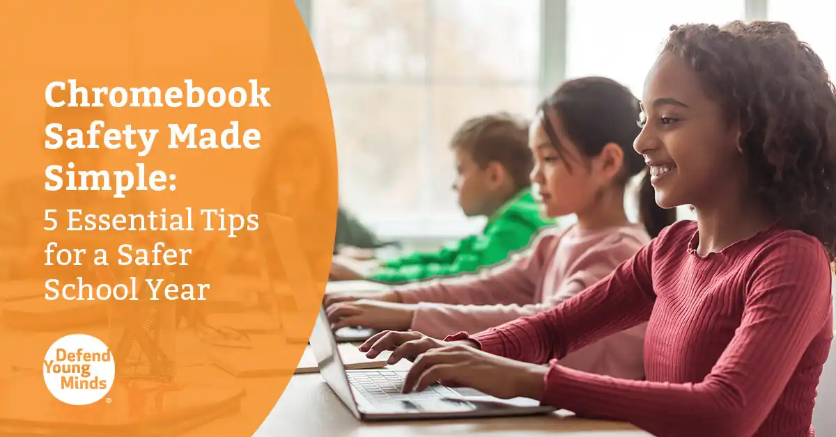 Smiling elementary school students using Chromebooks in a classroom, highlighting tips for Chromebook safety for kids during the school year.