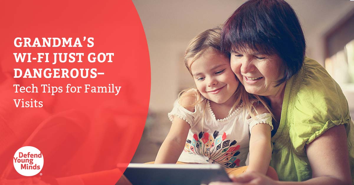 A grandma looking at a smart device with her granddaughter.