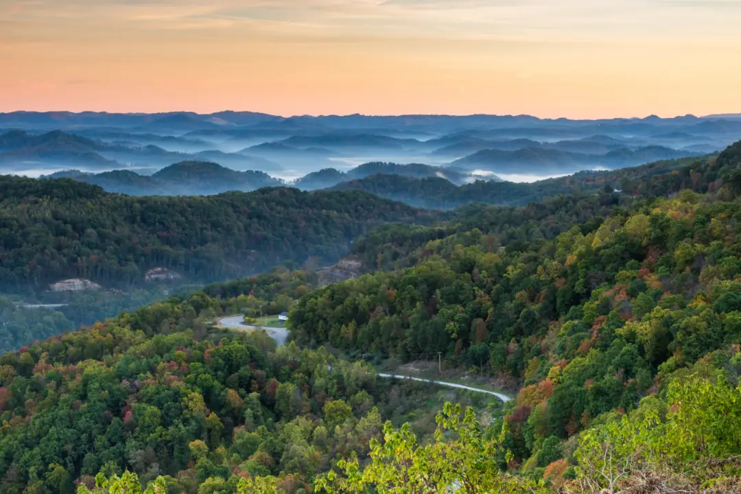 A photo of fog hanging over the hills of Kentucky in the morning.