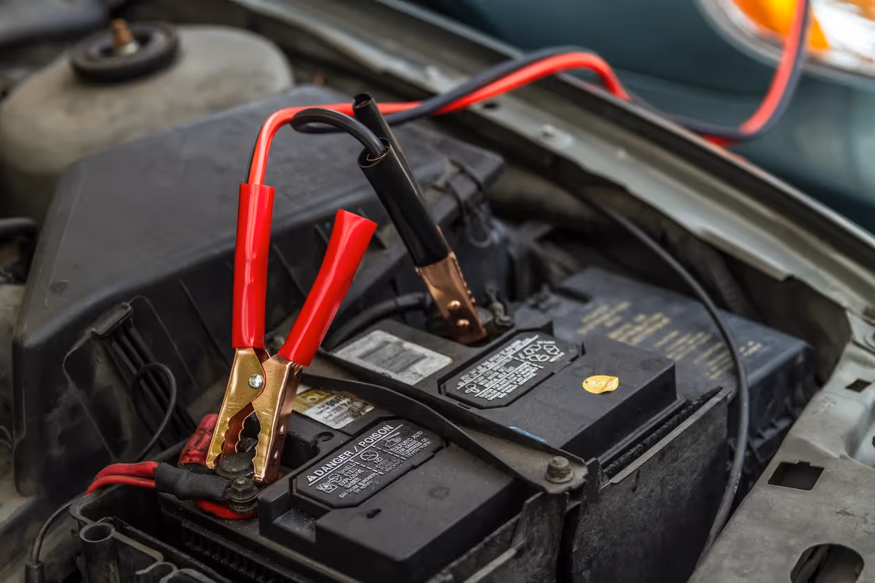 Car battery with jumper cables attached