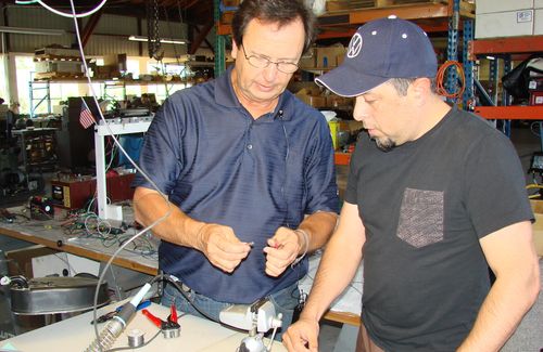 Instructor teaching student about EV wiring