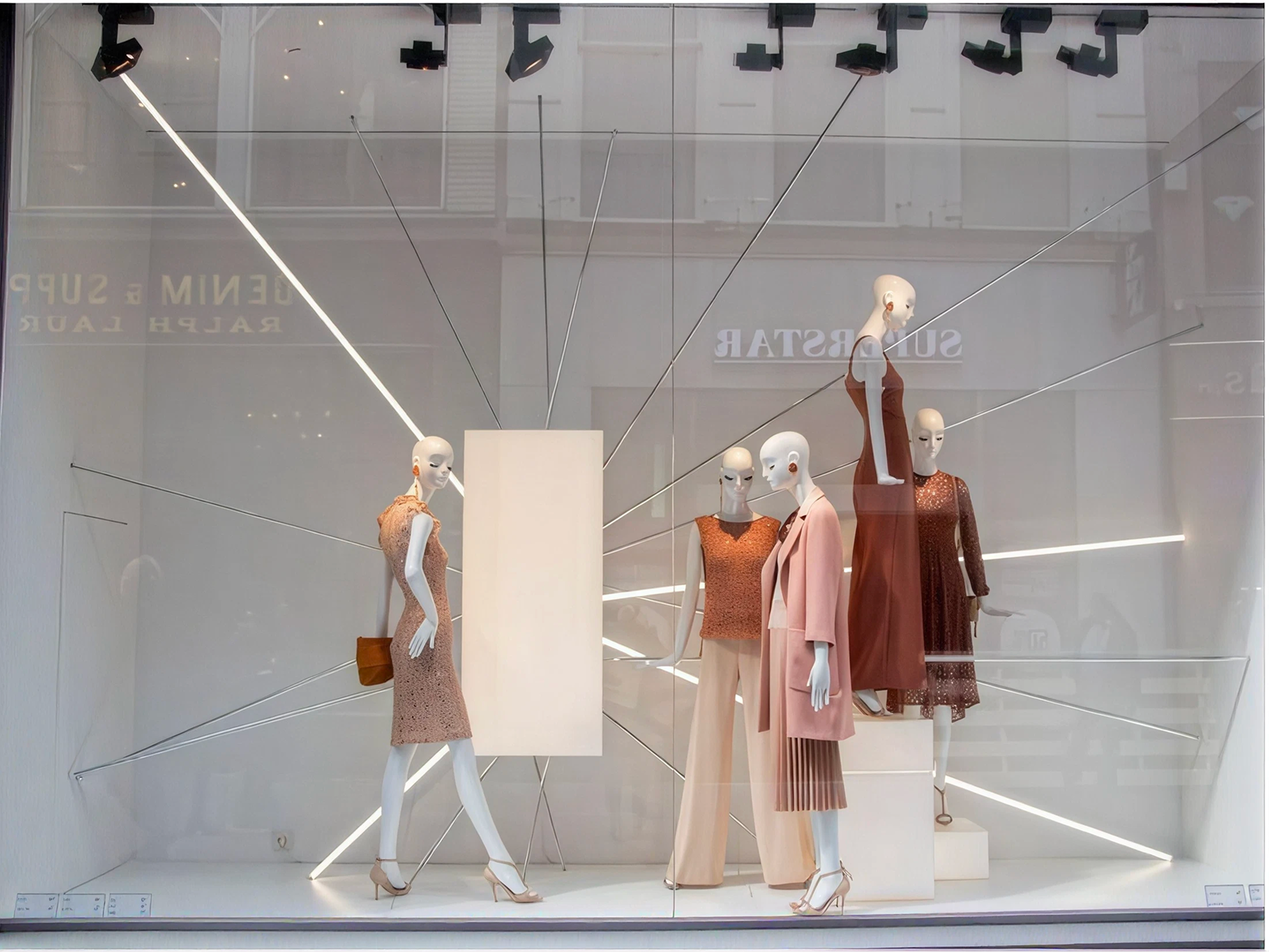 Zara window display featuring seasonal fashion outfits