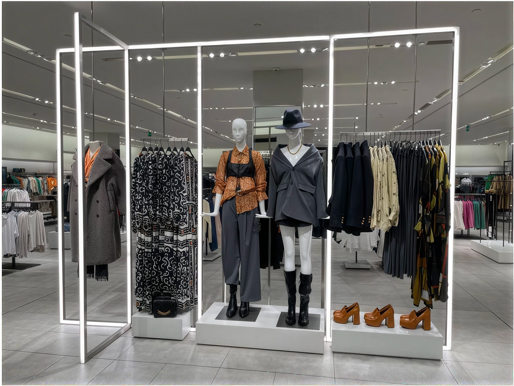 Zara store display with mannequins and clothing racks