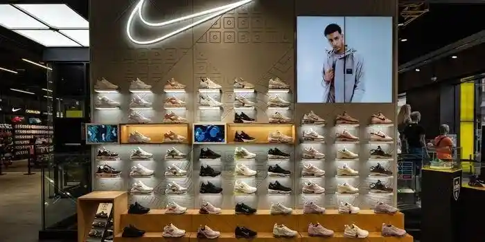Nike store wall showcasing athletic footwear