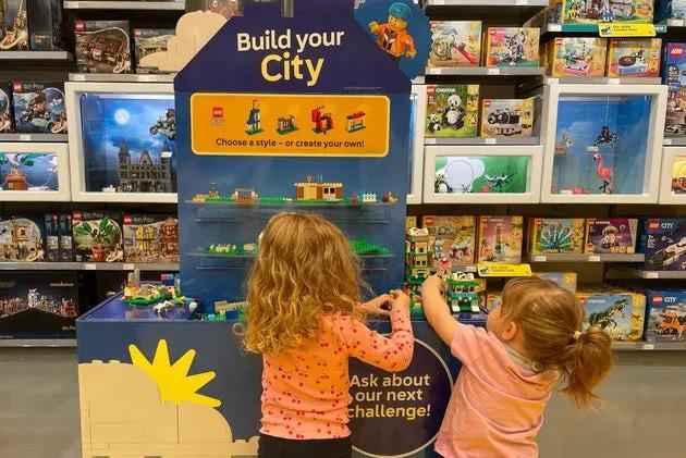 Children using LEGO Build Your City display