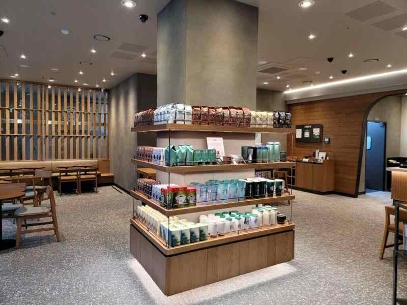 Starbucks store interior with organized merchandise displays