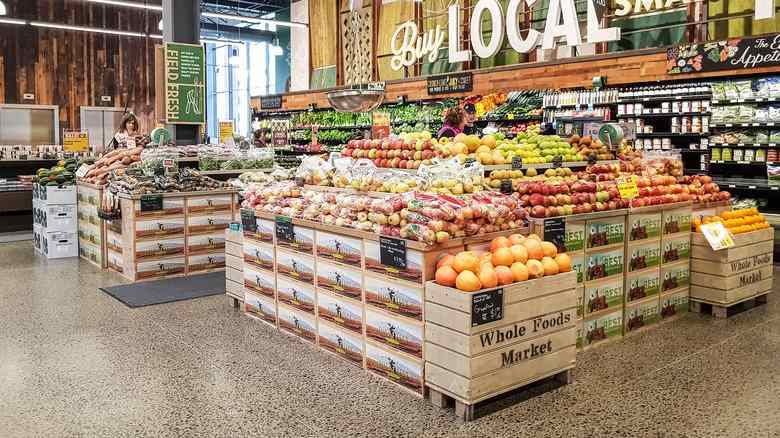 Grocery produce display with abundant fresh fruits and vegetables