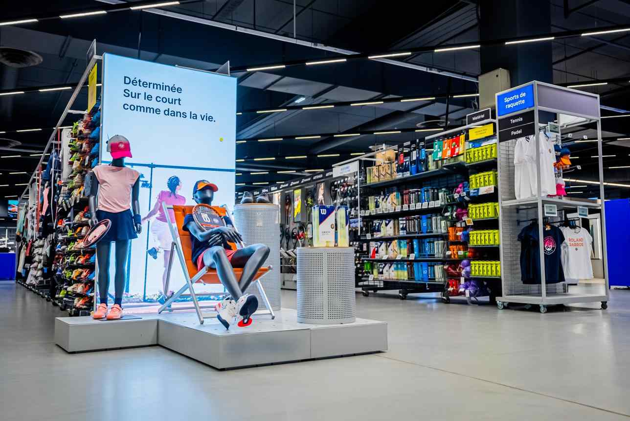 Decathlon store aisle with organized sports products