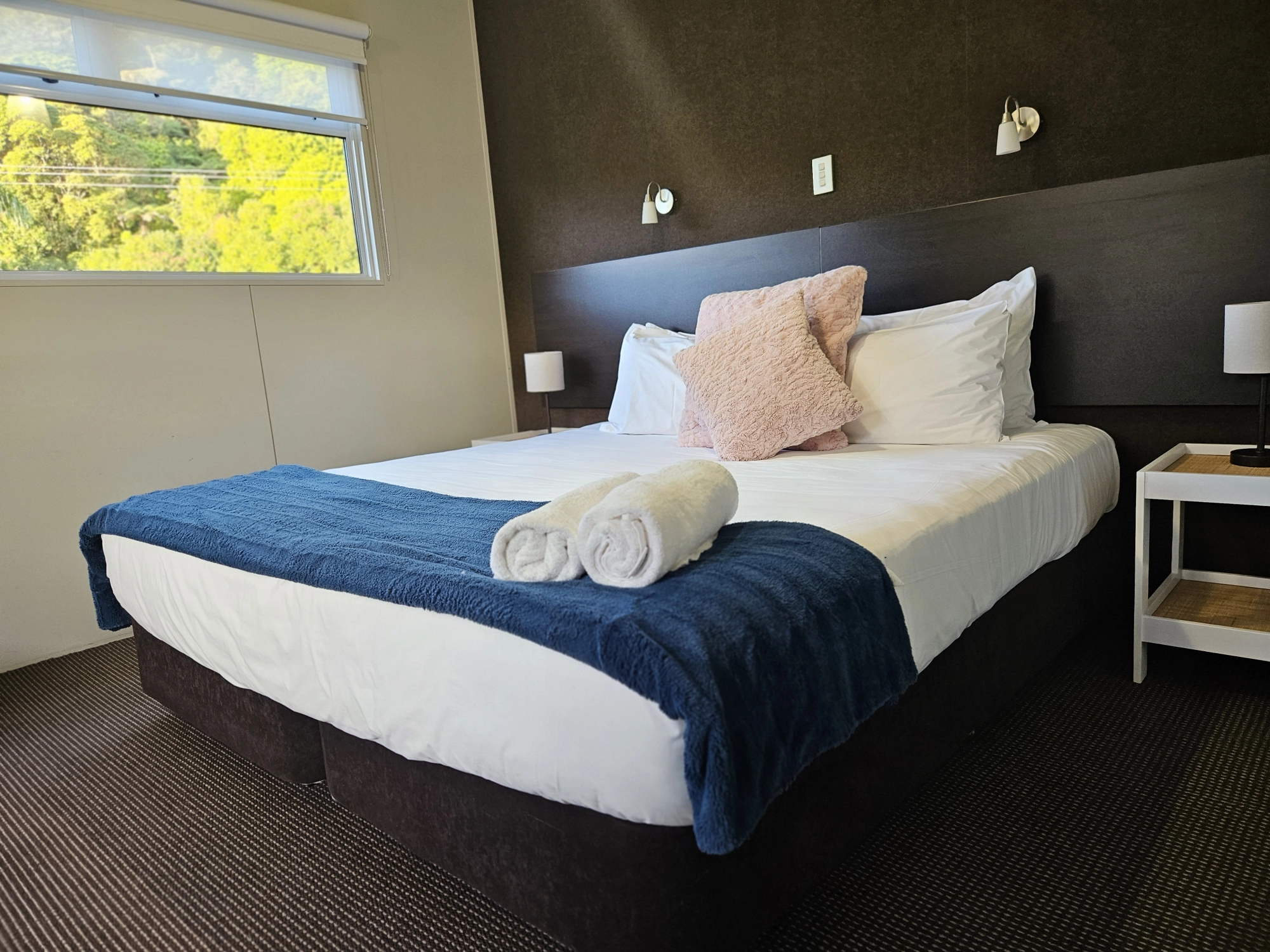 image of bedroom inside the cabin showing super king bed