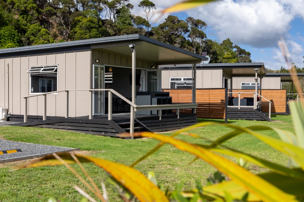 image of the outside of the cabins, showing the balcony and outdoor furniture