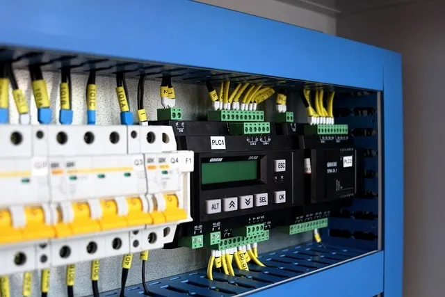 Programmable Logic Controller (PLC) panel used for automating industrial processes, managing inputs/outputs, and ensuring efficient control of machinery through programmable software logic.