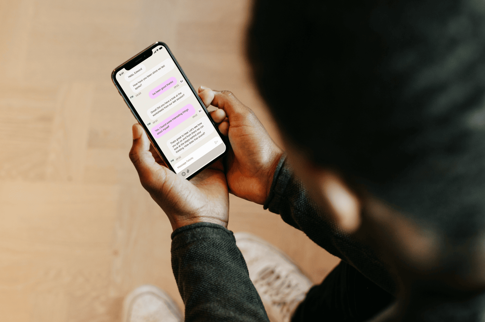 A man looking at his text messages on his phone.