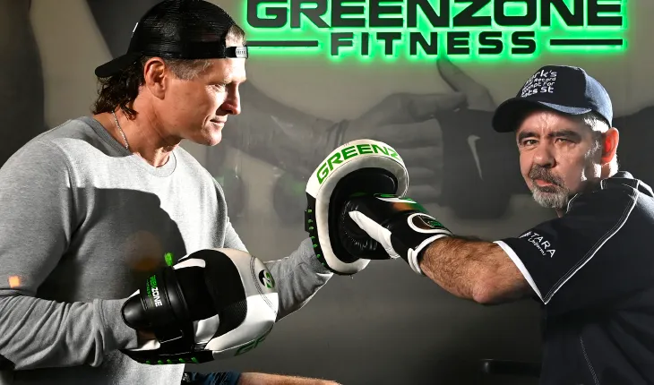 Mark Esler, former resident of brightwater oats street, trains with boxer danny green in the lead up to his world record attempt of longest distance travelled with one arm in a wheelchair