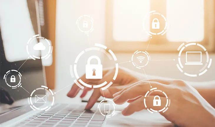 hands type on a laptop while iconography depicts a single secure logon leading to multiple applications