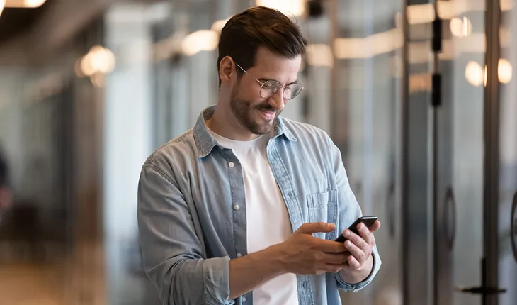 A facility user takes an image of something out of frame to log a maintenance request