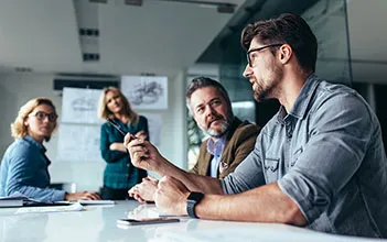 A facilities manager discusses requirements with a bunch of contractors.